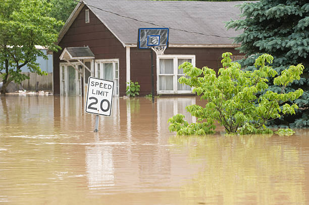 Flood waters in an Indiana town with flooded homes flood waters overtake a town in Indiana flooding stock pictures, royalty-free photos & images