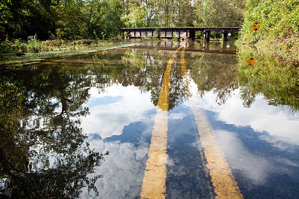 Flooded mountain road and tressel stock photo