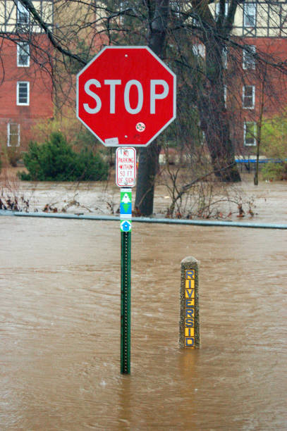 Flooded Road Following a Severe Storm in American Suburb Cranford, NJ, USA April 15, 2007 The suburban town of Cranford, New Jersey in inundated with severe flooding following heavy rains new jersey street flooding stock pictures, royalty-free photos & images