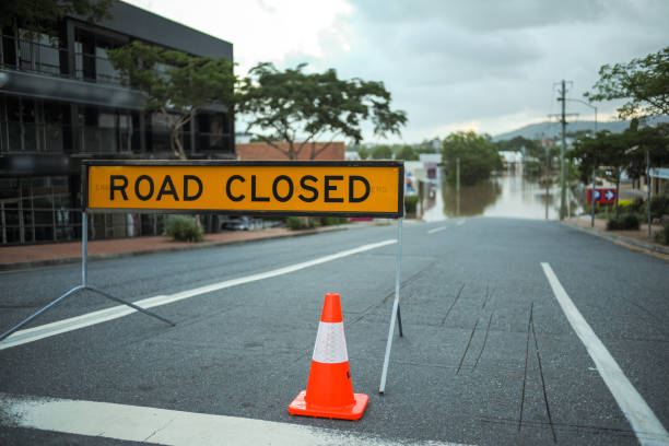 Flooded road in Brisbane and Road Closed sign stock photo