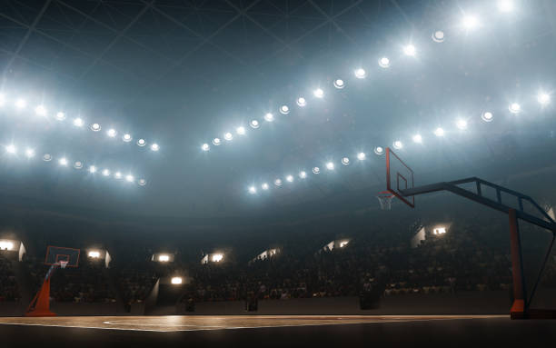 verlichte leeg basketbalveld - basketbalspeler stockfoto's en -beelden