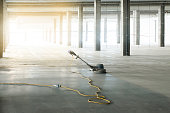 istock floor polishing machine inside a large industrial building, not people 1335074658