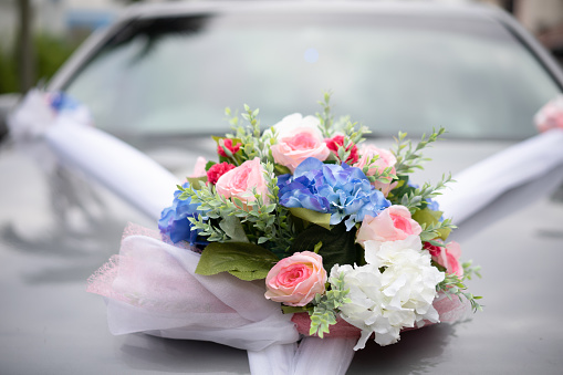 Floral wedding decoration on car