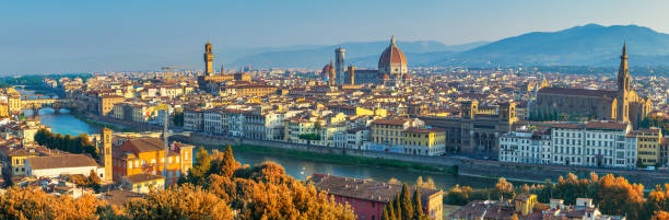 Florence Italy, panorama city skyline at Arno river with with autumn foliage season Florence Italy, panorama city skyline at Arno river with with autumn foliage season arno river stock pictures, royalty-free photos & images