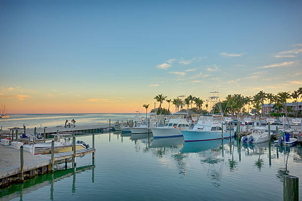 Florida Keys fishing boats in turquoise tropical blue water stock photo