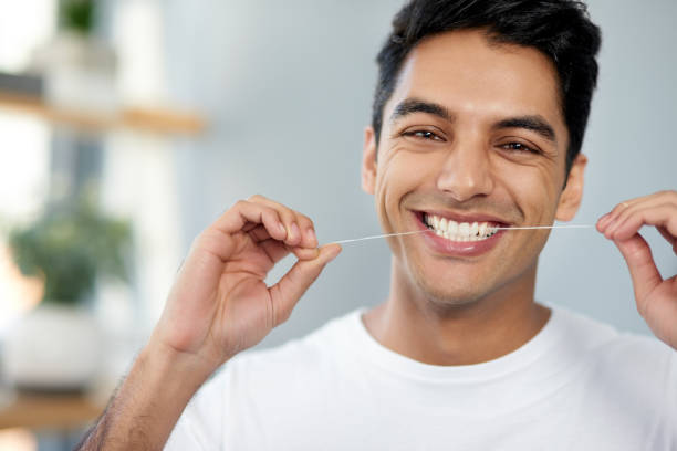 Flossing for healthier teeth stock photo