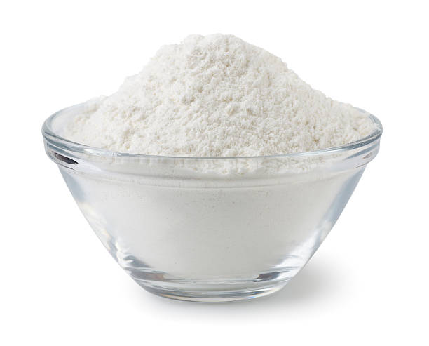Flour Glass bowl of wheat flour isolated on white flour stock pictures, royalty-free photos & images