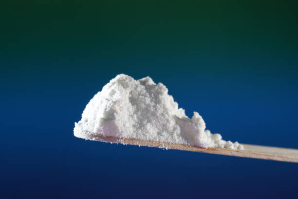 Flour that should look like a white drug with macro lens photographed in front of colorful gradient in the studio This is flour that should look like a white drug with macro lens photographed in front of colorful gradient in the studio amphetamine stock pictures, royalty-free photos & images