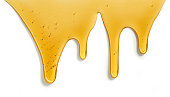 istock flowing honey on white background 1364855249