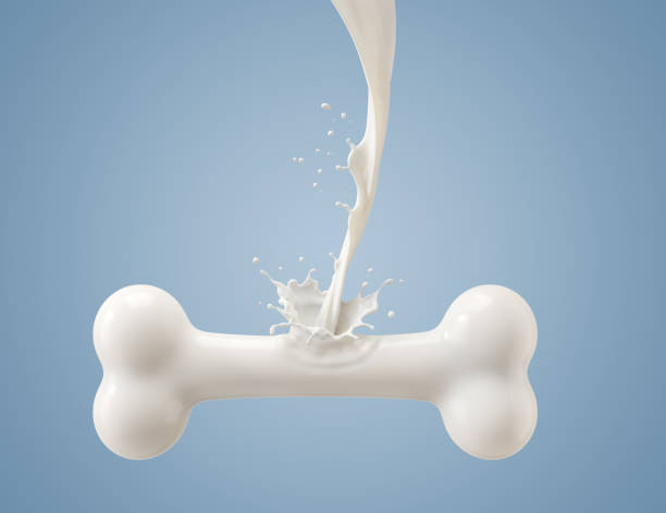 Flowing milk is a bone shape stock photo