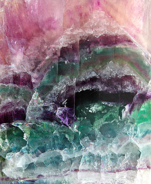 Fluorite pattern Pattern of a sparkling stone of fluorite poured by different colors flourite stock pictures, royalty-free photos & images