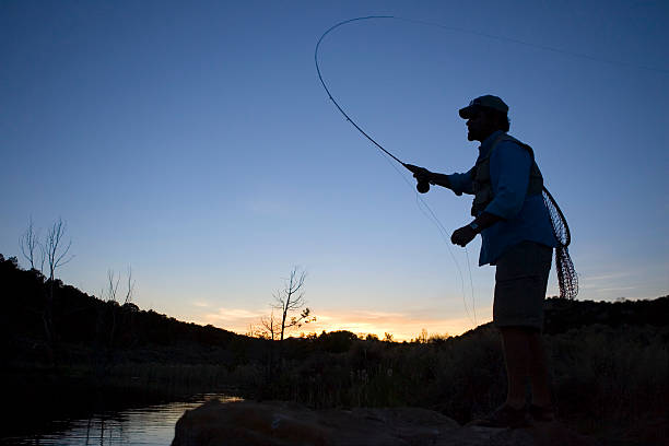 Fly Fishing at Sunset-horizontal stock photo