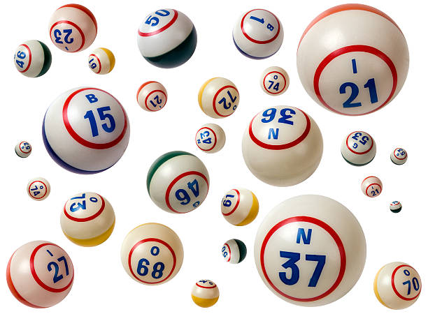 Flying Bingo balls with assorted numbers in white background stock photo
