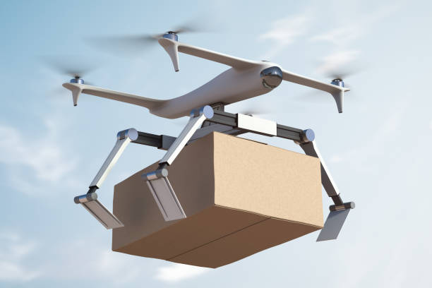 Flying drone courier drops a parcel stock photo