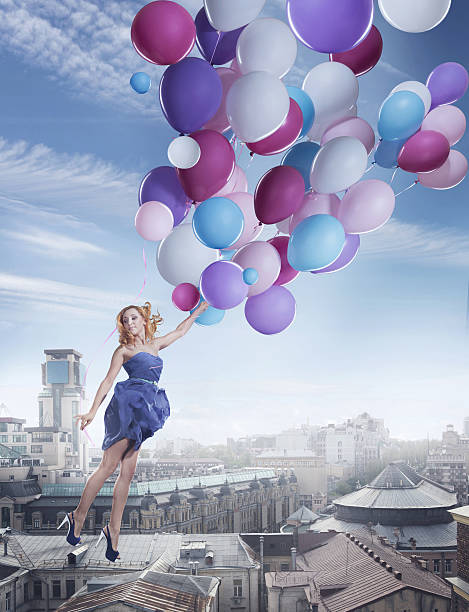 Flying with balloons stock photo