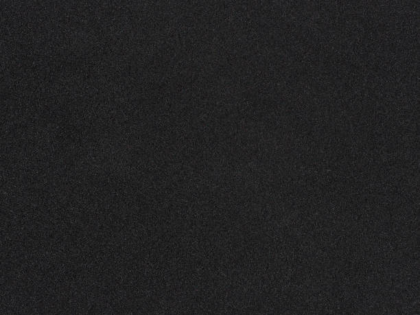 texture in gommapiuma. sfondo spugna nera. polistirolo scuro - materiale gommoso foto e immagini stock