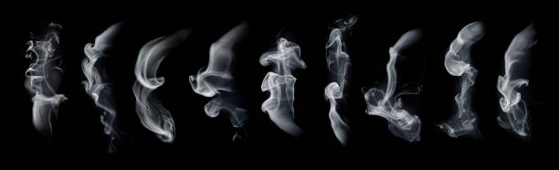 Fog or smoke set isolated on black background. White cloudiness, mist or smog background. Fog or smoke set isolated on black background. White cloudiness, mist or smog background. smoking activity stock pictures, royalty-free photos & images