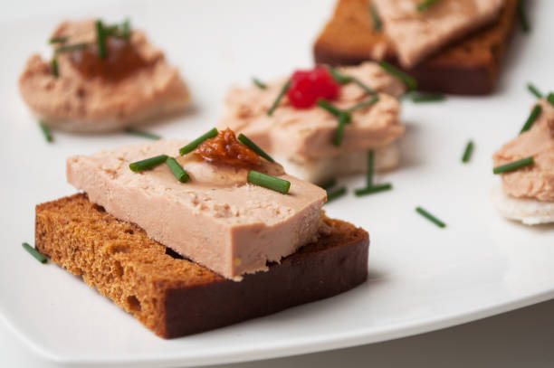 foie gras on gingerbread in festive plate closeup of foie gras on gingerbread in festive plate foie gras photos stock pictures, royalty-free photos & images