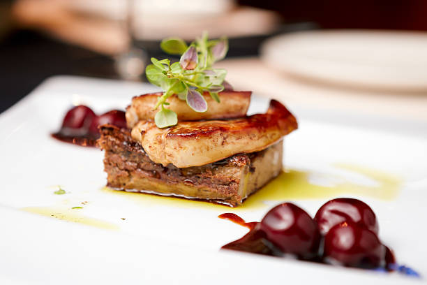 Foie gras Fried foie gras with cherry sauce and figs goose meat photos stock pictures, royalty-free photos & images