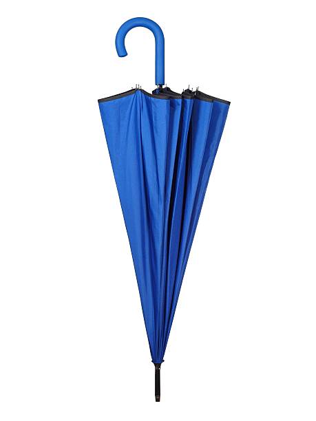 Folded blue umbrella on white stock photo