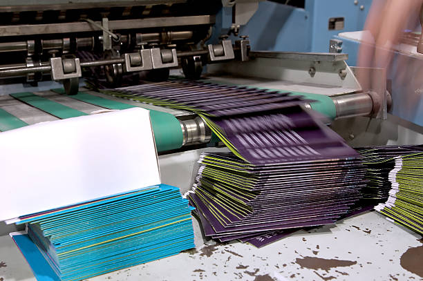 Folding Machine in Motion...  printing plant stock pictures, royalty-free photos & images