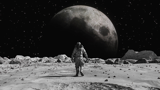 Following Shot of Brave Astronaut in Space Suit Confidently Walking on Space Planet Towards the Moon. Moon as viewed from Moon surface. The surface of the moon, strewn with small rocks and sand. Flight over Moon craters. Moon surface, Desert, Cliffs, sand. Covered in Rocks. First Astronaut On the Moon Surface. Big Moment for the Human Race. Advanced Technologies, Space Exploration/ Travel, Colonization Concept.