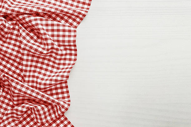 Food background Food background, high angle view of white wooden table with red, folded, checkered tablecloth copy space textile industry photos stock pictures, royalty-free photos & images
