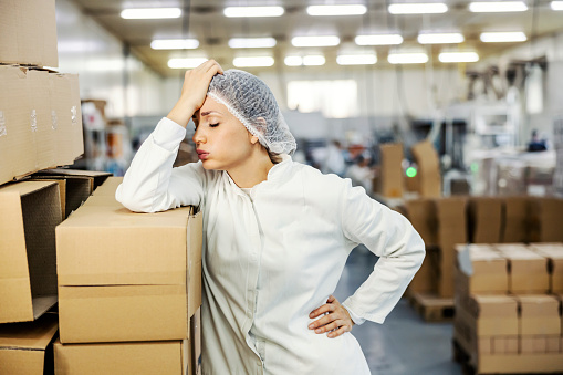 A female food factory worker having failure at work.