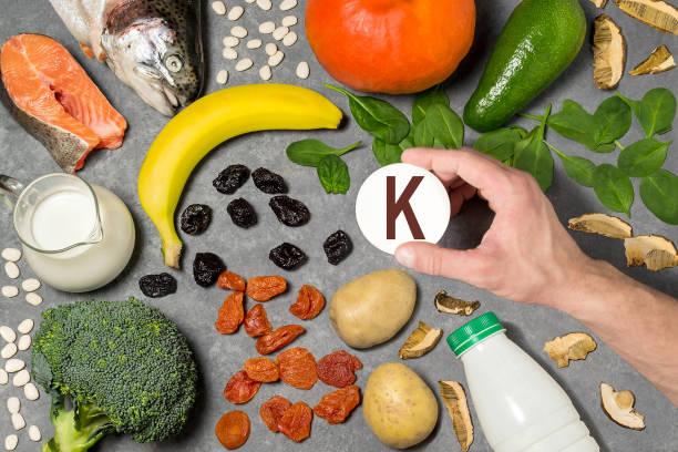 Food rich in potassium Food rich in potassium. Various natural sources of vitamins and micronutrients. Useful food for health and balanced diet. Prevention of avitaminosis. Man's hand holds tag with name of potassium potassium stock pictures, royalty-free photos & images