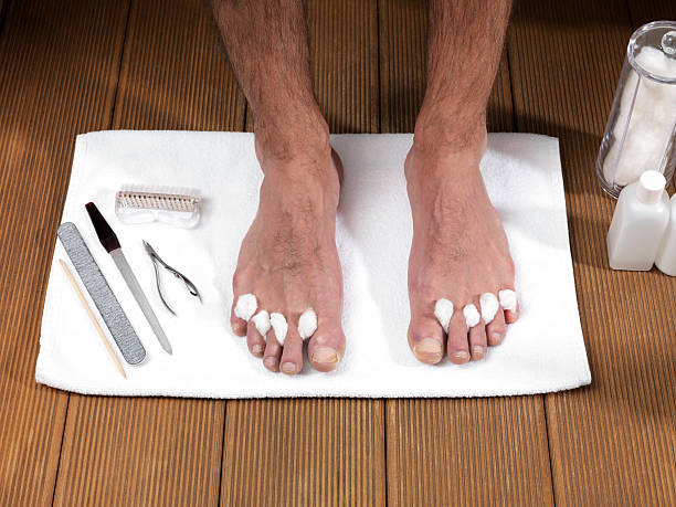 Foot Care (Click for more) Men's Foot Care In The Beauty Parlour (Pedicure) man pedicure stock pictures, royalty-free photos & images
