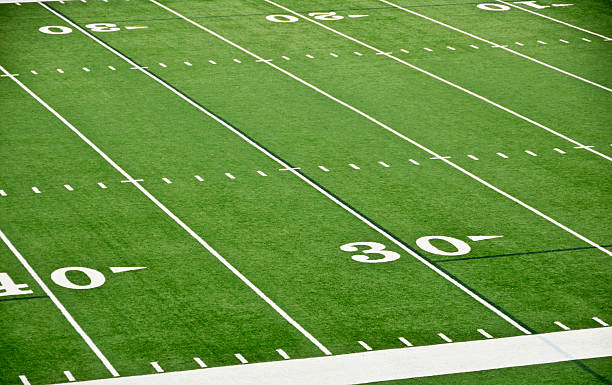 Football Field Football field background - Please see my portfolio for other sports related images and backgrounds. american football field stadium stock pictures, royalty-free photos & images