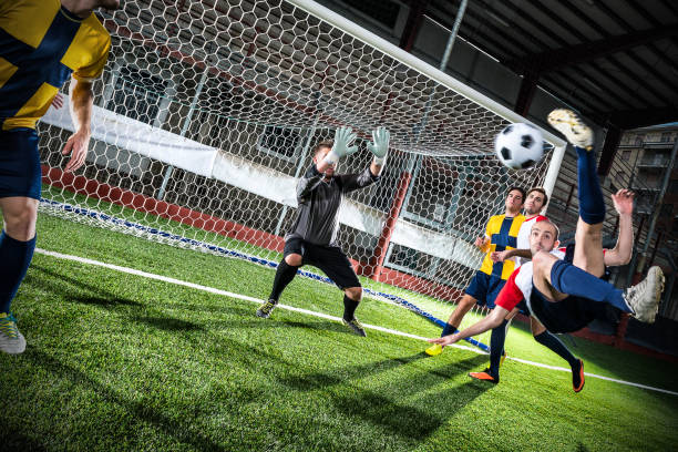 Football match in stadium: Bicycle kick Football match in stadium: Bicycle kick soccer striker stock pictures, royalty-free photos & images