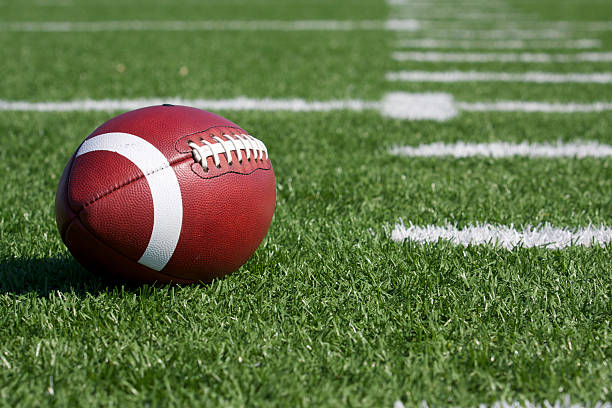 Football on the Field American Football on the Field american football stock pictures, royalty-free photos & images