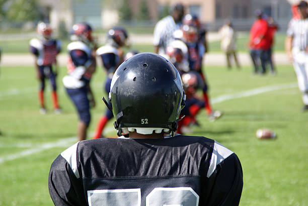 Football Player Football team member joining the game. american football player stock pictures, royalty-free photos & images