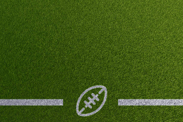 Football theme paint on empty grass field