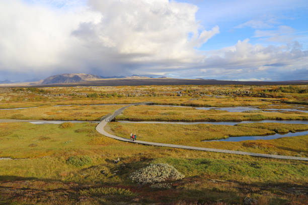 A footpath in the Thingvellir. A scenic view of Thingvellir national park before rain. stock photo