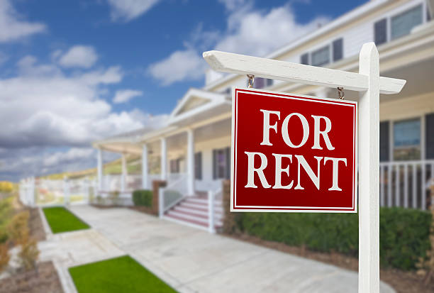 For Rent Real Estate Sign in Front of House stock photo