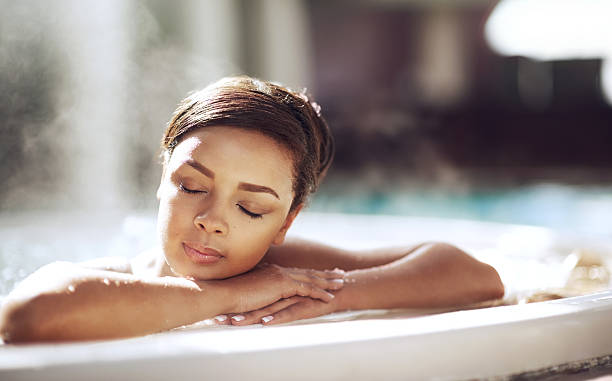 For wellness just add water Shot of a young woman relaxing in the hot tub at a spahttp://195.154.178.81/DATA/i_collage/pi/shoots/805701.jpg hot tub stock pictures, royalty-free photos & images