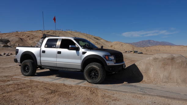 Ford F-150 Raptor at Truckhaven obstacle challenge course stock photo