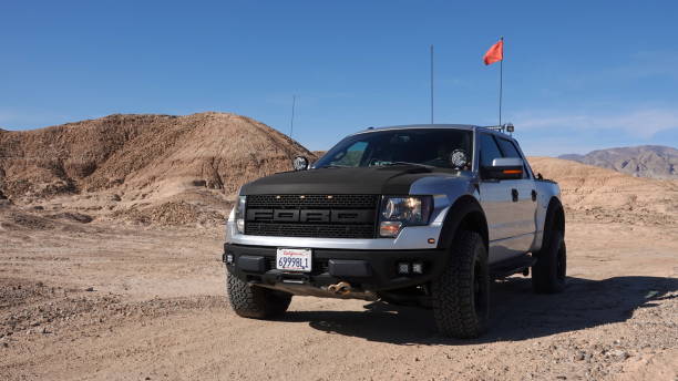2011 Ford F-150 Raptor SVT driving off-road in the desert stock photo