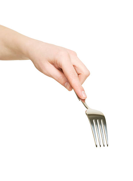 Fork it! Hand holding a fork isolated on a white background. fork stock pictures, royalty-free photos & images