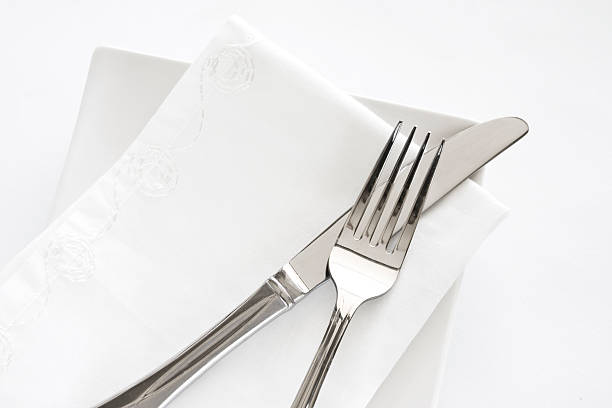 Fork, Knife and White Napkin Table Setting stock photo