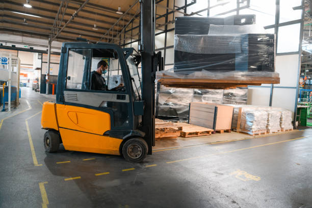 Forklift loader in storage warehouse ship yard. Distribution products. Delivery. Logistics. Transportation. Business background stock photo