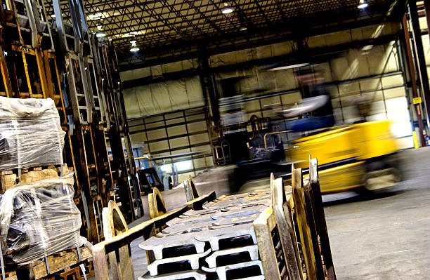 Forklift moving in factory stock photo