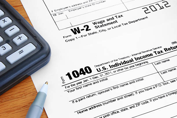 Form 1040 Income Tax and 2012 W2 Wage Statement stock photo