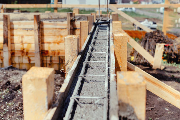 Foundation site of new building - construction industry details, cement and concrete building stock photo