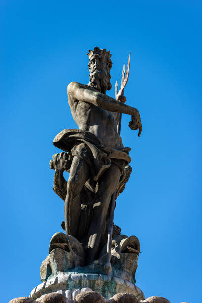 Fountain of Neptune - Bronze statue in the Cathedral square Trento Italy Fountain of Neptune, bronze statue of the Roman God with the trident in the Cathedral square (Piazza del Duomo), Trento downtown, Trentino-Alto Adige, Italy, Europe poseidon statue stock pictures, royalty-free photos & images
