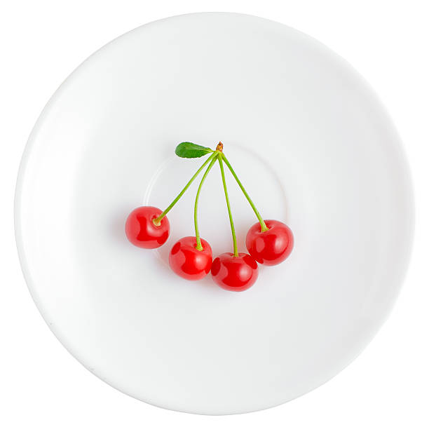 Four cherries | Isolated stock photo