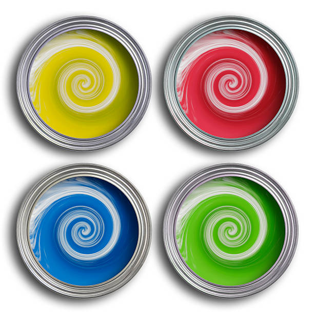 Four coloured paint tins with swirling paint stock photo