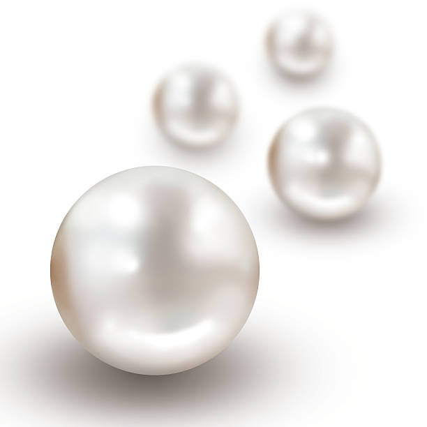 Four pearls with narrow depth of field isolated on white stock photo